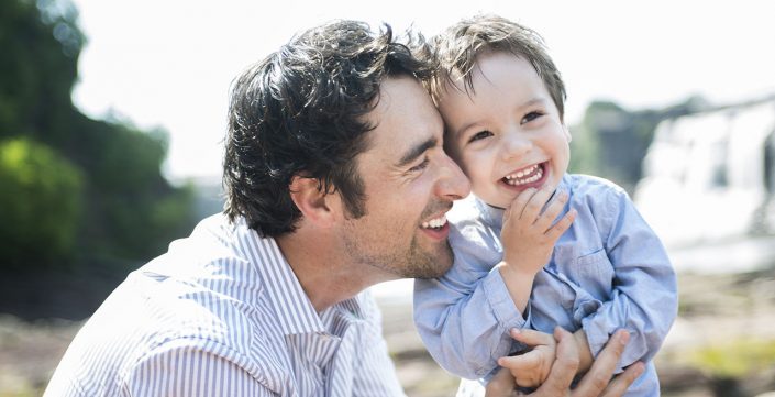 happy joyful father having fun with is child